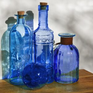 Blue bottles in the sunlight.